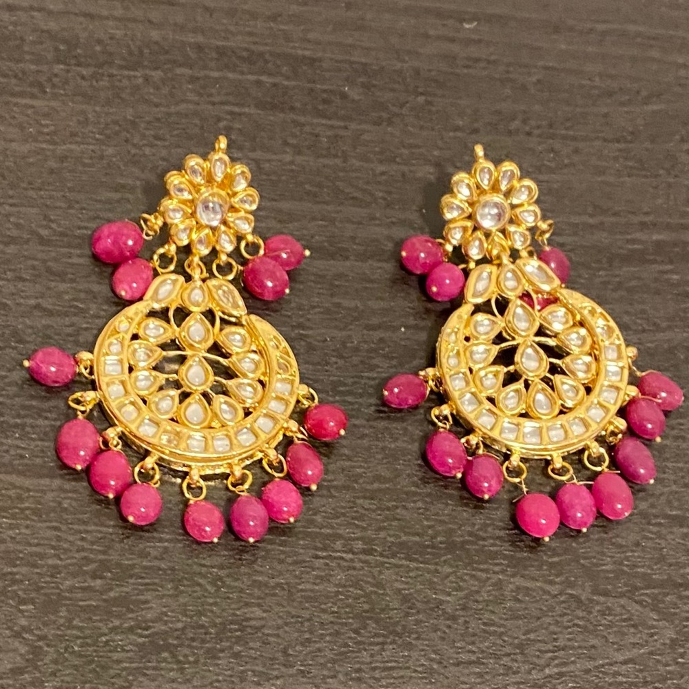 Kundan inspired drop earrings with pink stones.